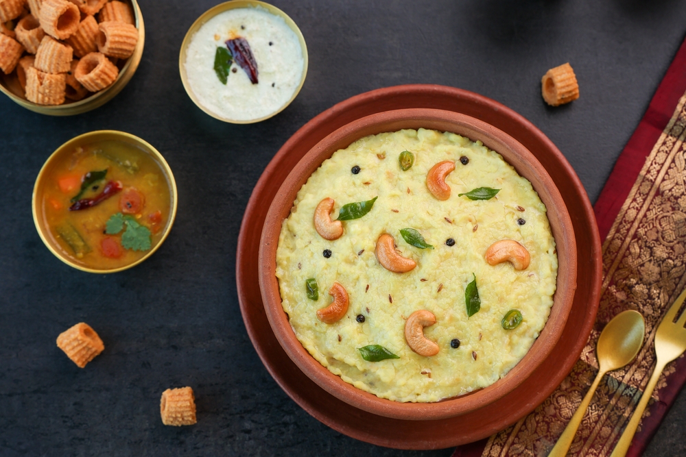 Ven pongal with cutney and sambhar on the table